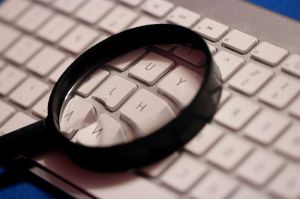 magnifying-glass-atop-computer-wireless-keyboard-725x483